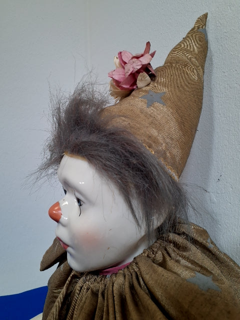 Pink-guld Harlekin dukke